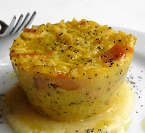 Rice timbales with saffron, poppy seeds and vegan ham served with an apple sauce